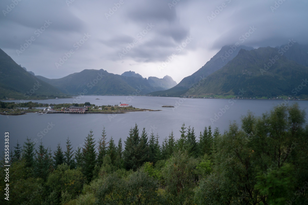 landscape view of a village in the fiords of Lofoten Islands, Norway on a cloudy day