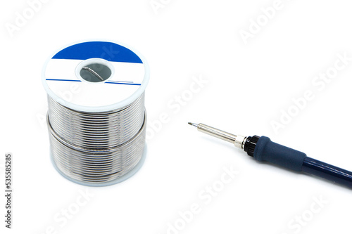 Soldering iron and solder wire isolated on white background. photo