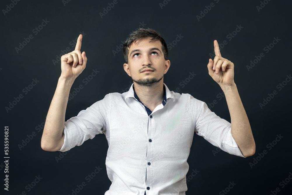 the man understood his eyes upward and points there with his hands. concept of divine the man understood his eyes upward and points there with his hands. concept of divine