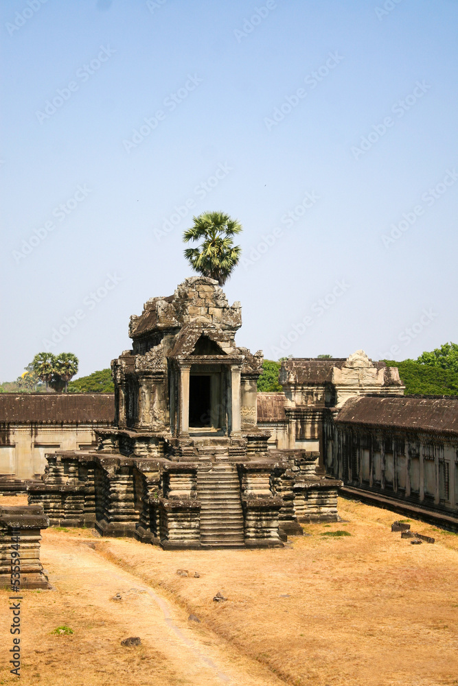 A building with steps in Angkor Wat, a temple complex in Cambodia, the largest religious monument in the world, and a UNESCO World Heritage Site.  Image has copy space.