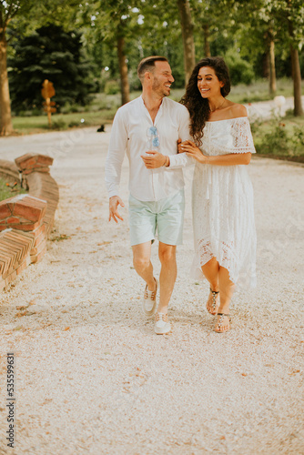 Young couple walking in the...