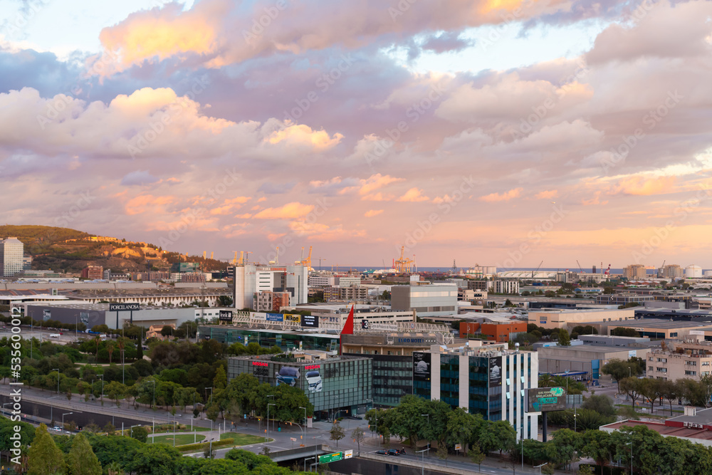Fototapeta premium Sunset with dark clouds over Barcelona city