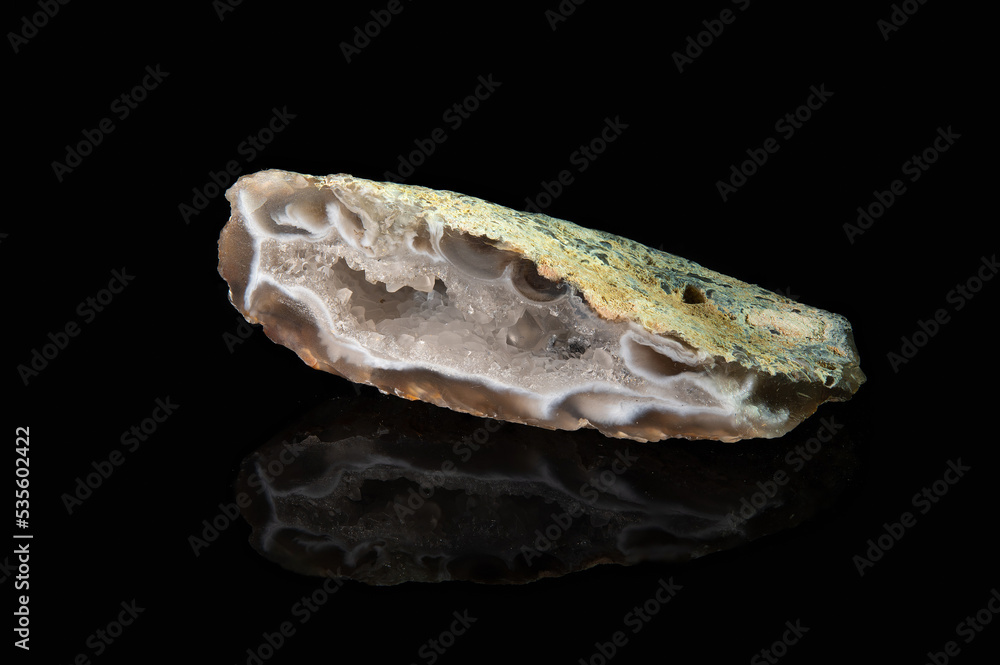 A shard of the chalcedony geode mineral, translucent brown with white veins A shard of the chalcedony geode mineral, translucent brown with white veins