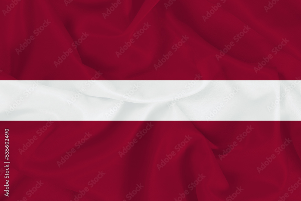 Latvia flag on wavy fabric, waving realistic national symbol of Latvia Latvia flag on wavy fabric, waving realistic national symbol of Latvia