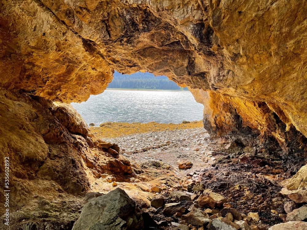 Sea cave made out of rare yellow rock