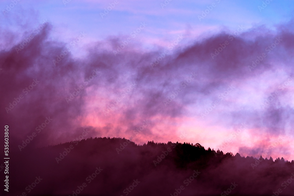 Mountain silhouette at dawn sky with scattered clouds, cold morning in Guatemala, Central America. Mountain silhouette at dawn sky with scattered clouds, cold morning in Guatemala, Central America.