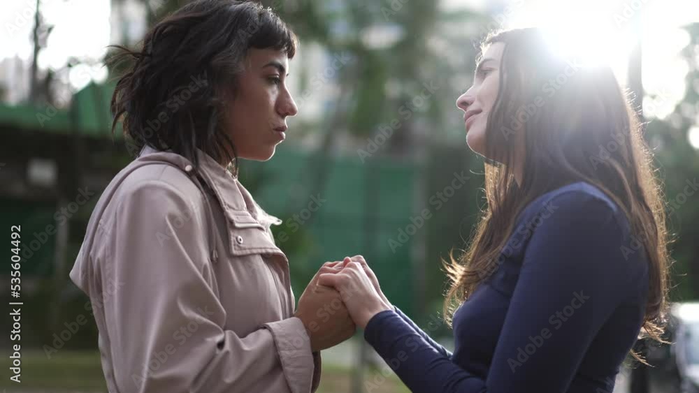 Female friends empathy and SUPPORT. Two young women hugging each other with CARE and affection during difficult times Female friends empathy and SUPPORT. Two young women hugging each other with CARE and affection during difficult times