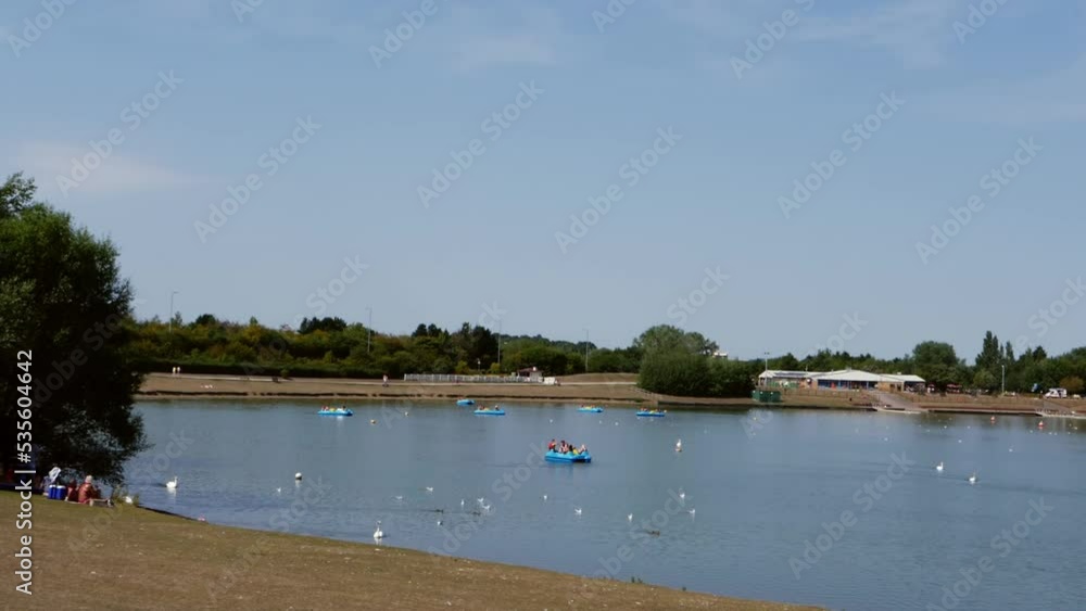 Tourists enjoying activities on boating lake Tourists enjoying activities on boating lake