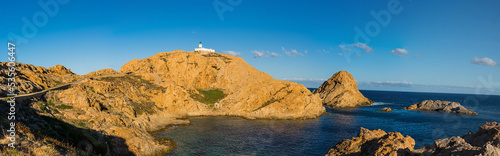 The old lighthouse on the rocky Pietra peninsula in the L'Ile-Rousse commune of France on Corsica, France © majonit