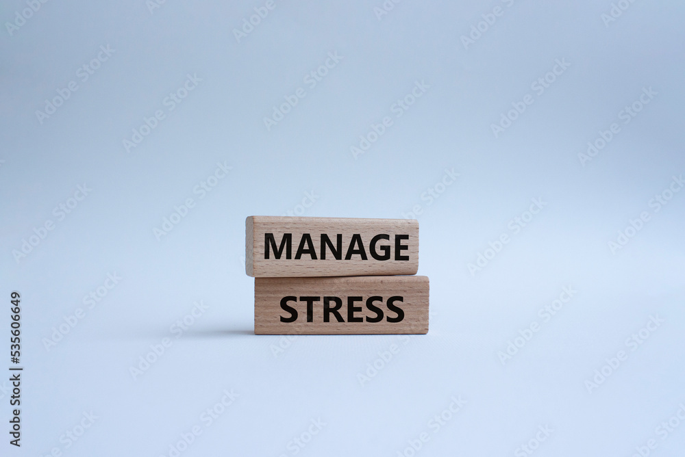 Manage stress symbol. Concept word Manage stress on wooden blocks. Beautiful white background. Business and Manage stress concept. Copy space Manage stress symbol. Concept word Manage stress on wooden blocks. Beautiful white background. Business and Manage stress concept. Copy space