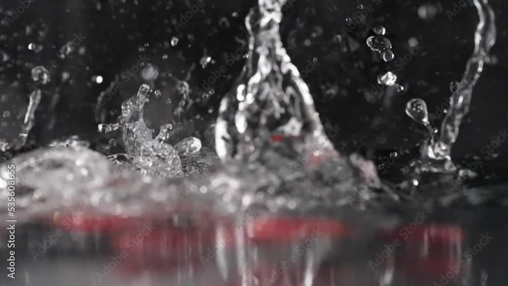 fresh juicy cherry tomato falling into water fresh juicy cherry tomato falling into water