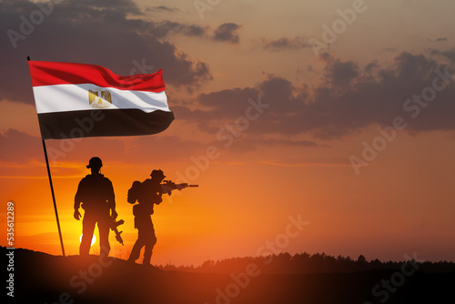 Silhouette Of Soliders Against the Sunrise in desert . Concept - armed forces of Egypt. Egypt celebration. Greeting card for Independence day  Memorial Day  Armed forces day  Sinai Liberation Day.