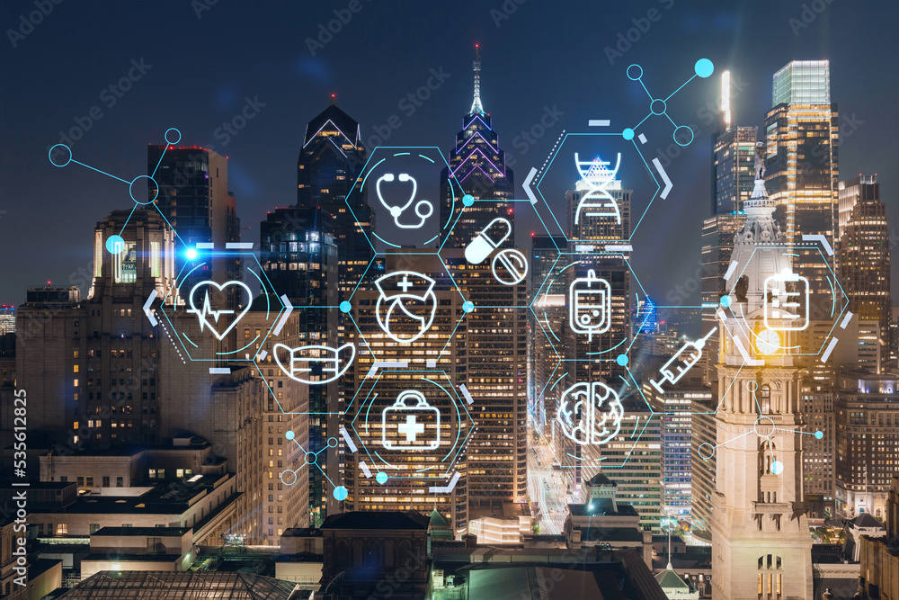 Aerial panoramic cityscape of Philadelphia financial downtown at night time, Pennsylvania, USA. Hologram healthcare digital medicine icons. The concept of treatment from disease, Threat of pandemic