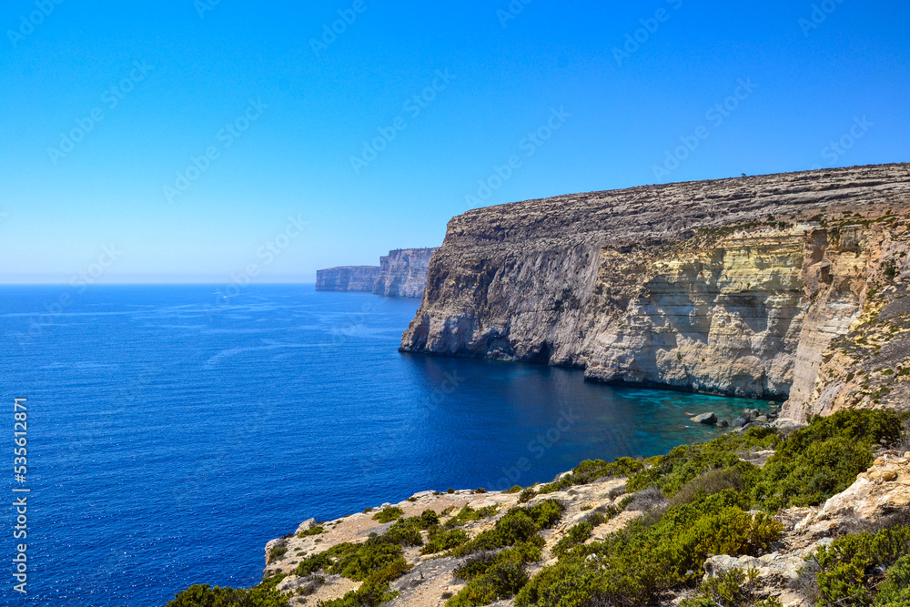 Seaside cliff with turquoise blue water