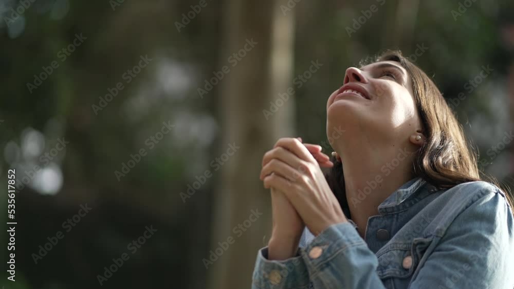 Hopeful happy woman looking at sky smiling. Faithful spiritual person celebrating life Hopeful happy woman looking at sky smiling. Faithful spiritual person celebrating life