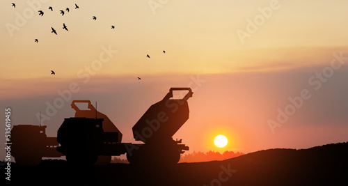 Artillery rocket system are aimed to the sky at sunset. Multiple launch rocket system. 3d-rendering. © hamara
