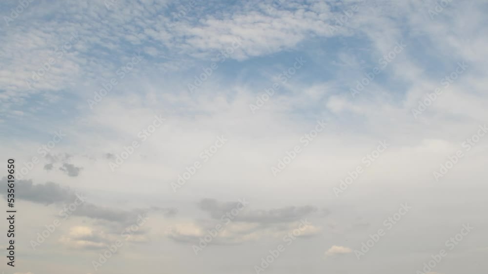 Timelapse with blue sky with clouds. Clouds located in two layers at different heights move in different directions. Unusual celestial phenomenon. Timelapse with blue sky with clouds. Clouds located in two layers at different heights move in different directions. Unusual celestial phenomenon.