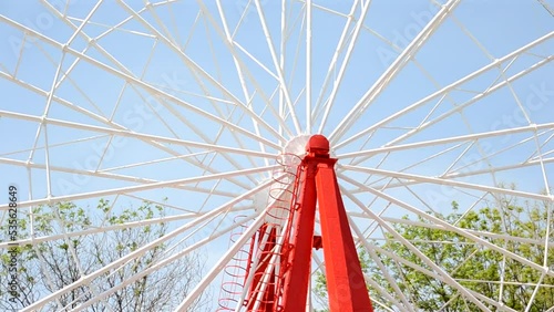 Brightly colored Ferris wheel against the blue sky photo