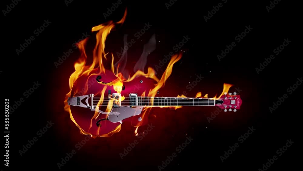 Burning rock guitar on a black background. Slow motion fire flames, explosions, sparks.