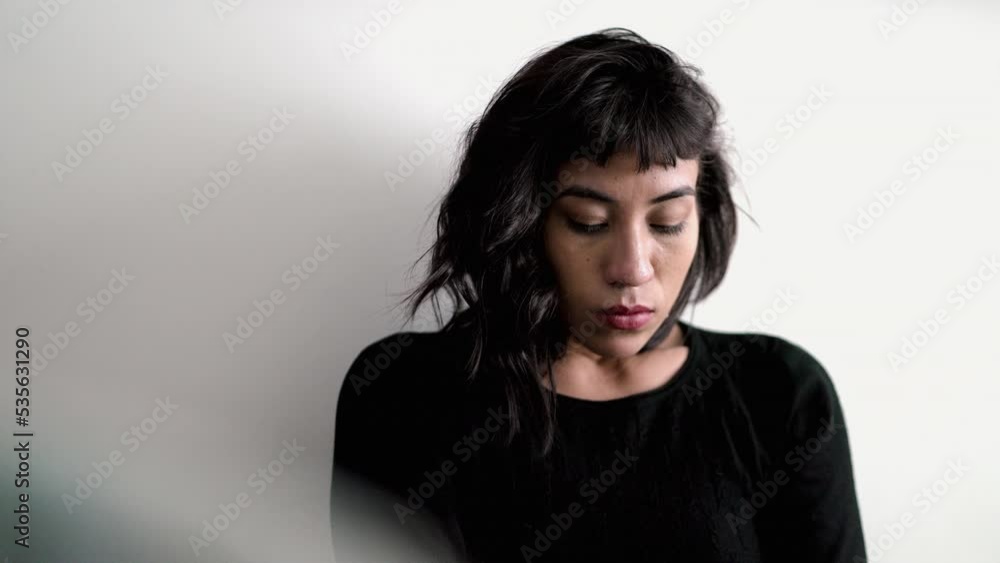 One preoccupied hispanic woman feeling worry. Pensive thoughtful girl One preoccupied hispanic woman feeling worry. Pensive thoughtful girl