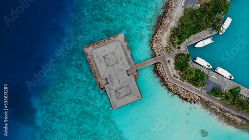 Pier with boats among the blue ocean, top view © WhyNotTrip