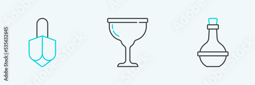 Set line Jewish wine bottle, Hanukkah dreidel and goblet icon. Vector
