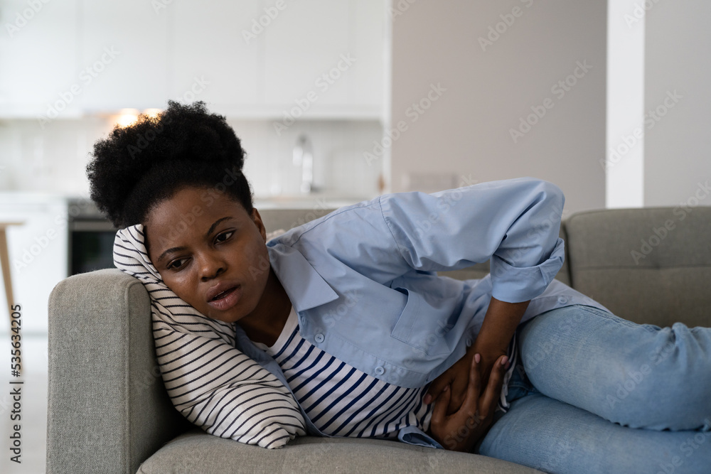 Stockfoto Sick African American woman experiencing health problems