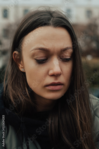portrait of crying young woman on the street © Елена Вырыпаева