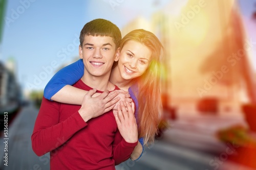 Happy young couple have fun on street background