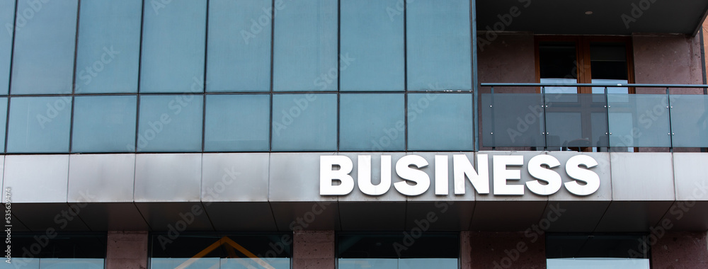Fototapeta premium Business is written on the facade of the building.