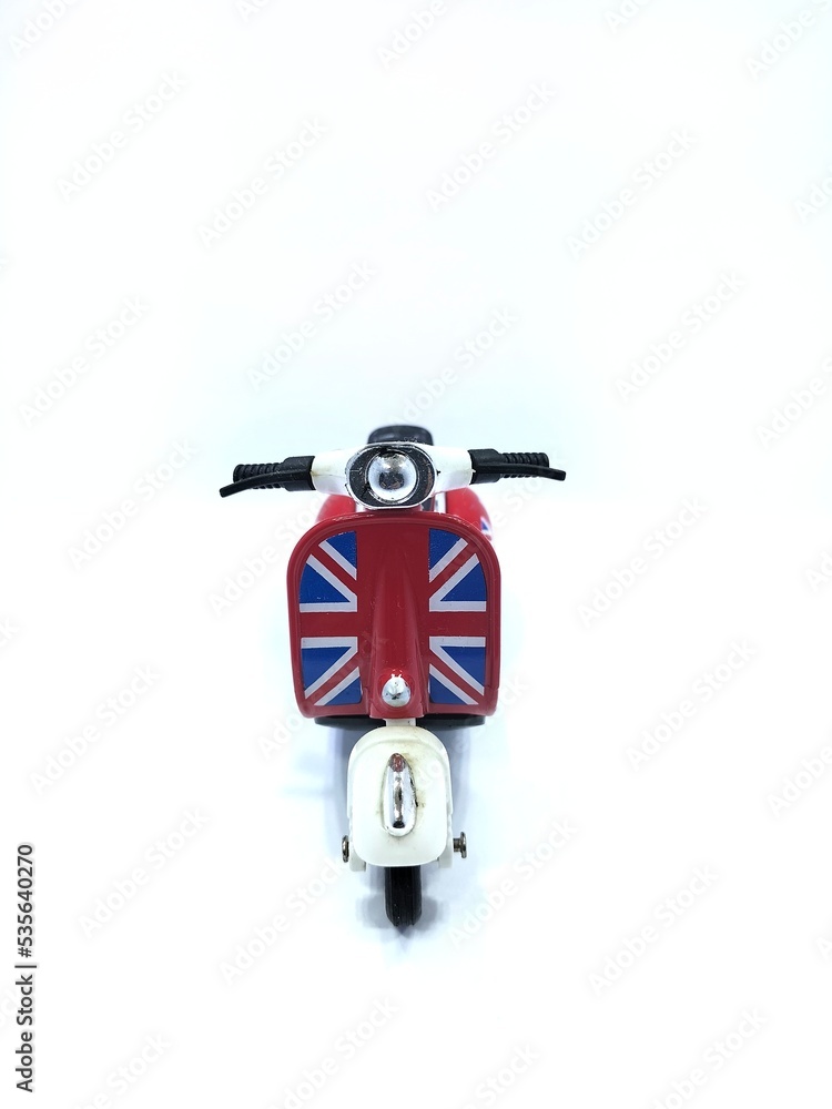 Obraz premium Miniature scooter motorcycle, isolated on a white background, front view.
