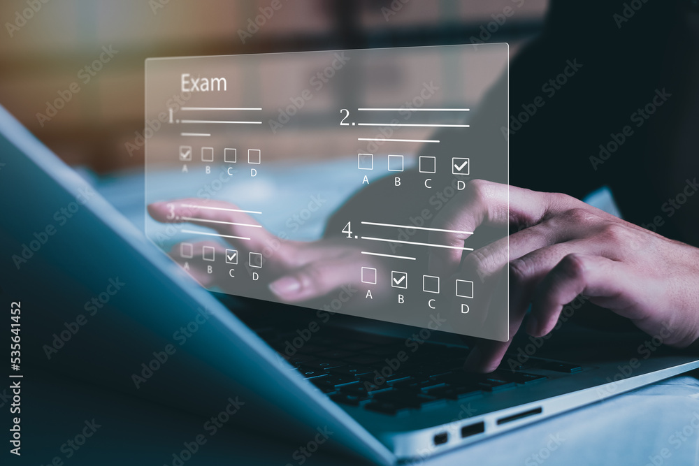 Fototapeta premium online exam concept, choose correct answer in test. checklist and online testing on laptop. online exam test with laptop. on-line questionnaire results on desktop. quiz.