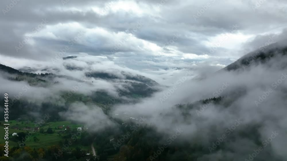 Carpathian Mountains. Ukraine. Flying over the fog with amazing forest view. Cinematic drone footage. Traveling around Ukraine. Holiday in the wild forest. Misty weather in the forest. Aerial view. Carpathian Mountains. Ukraine. Flying over the fog with amazing forest view. Cinematic drone footage. Traveling around Ukraine. Holiday in the wild forest. Misty weather in the forest. Aerial view.