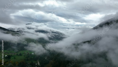 Wallpaper Mural Carpathian Mountains. Ukraine. Flying over the fog with amazing forest view. Cinematic drone footage. Traveling around Ukraine. Holiday in the wild forest. Misty weather in the forest. Aerial view.  Torontodigital.ca