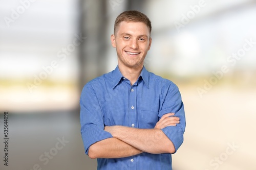 Young man posing on light background