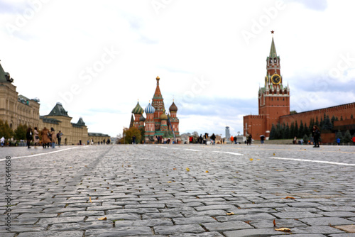 Defocused view to Kremlin tower and St. Basil's Cathedral on Red square in autumn Moscow