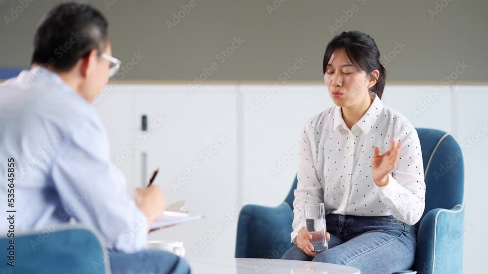 young woman doctor and midaged man in meeting room young woman doctor and midaged man in meeting room