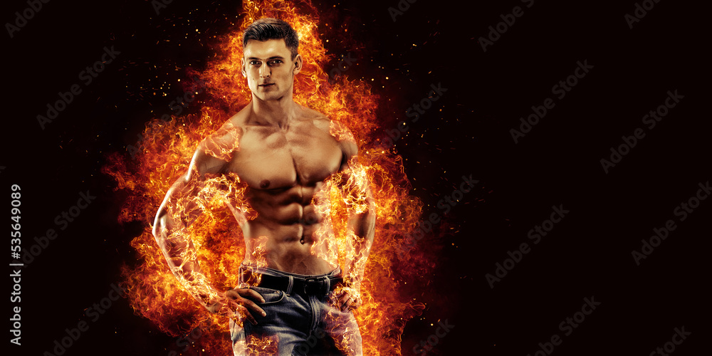 Bodybuilder posing on the fire flames background Bodybuilder posing on the fire flames background
