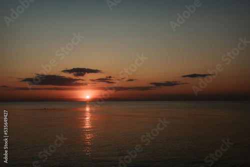 Magic sunset on the sea. Ocean at dawn. Travel to the islands. Postcard for a travel agency