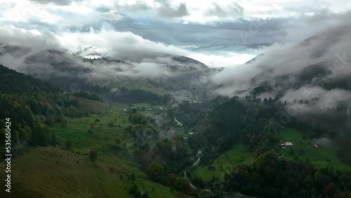 Wallpaper Mural Ukrainian Carpathian village from above. Misty foggy morning in Carpathian Mountains. Cinematic 4K drone footage.  Torontodigital.ca