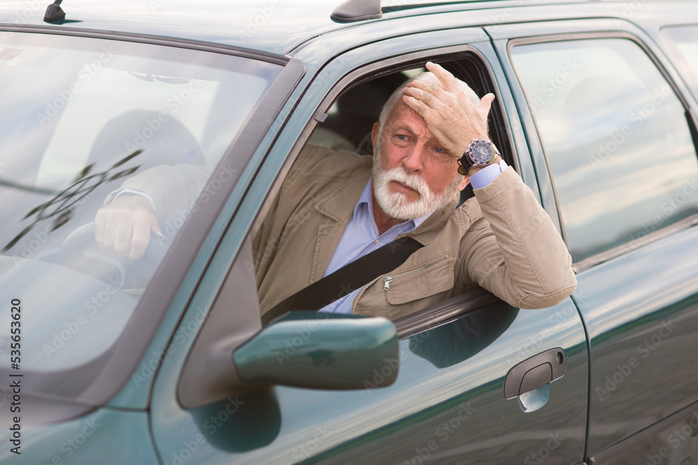 Angry senior man driver stuck with his car in a traffic jam Stock Photo ...