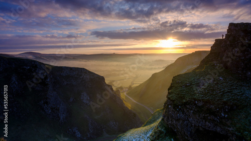 Frosty sunrise over Winnats Pass in the Peak District National Park, UK photo