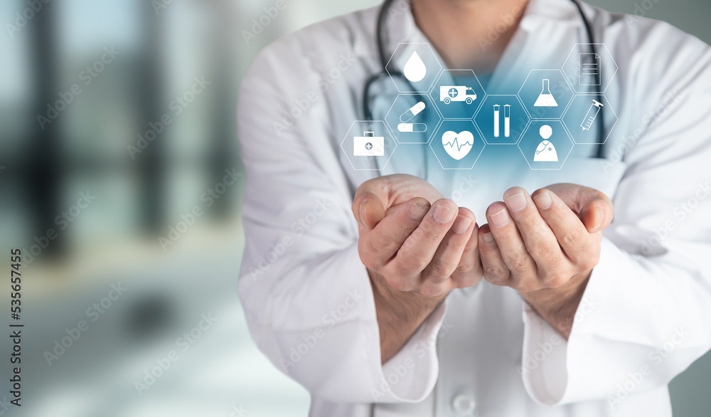 Doctor holding medical icons in hand Doctor holding medical icons in hand