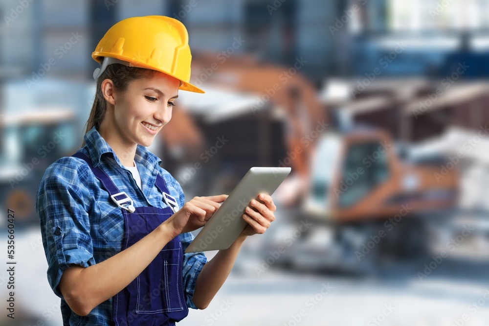 Young engineer on factory, checking up process Young engineer on factory, checking up process