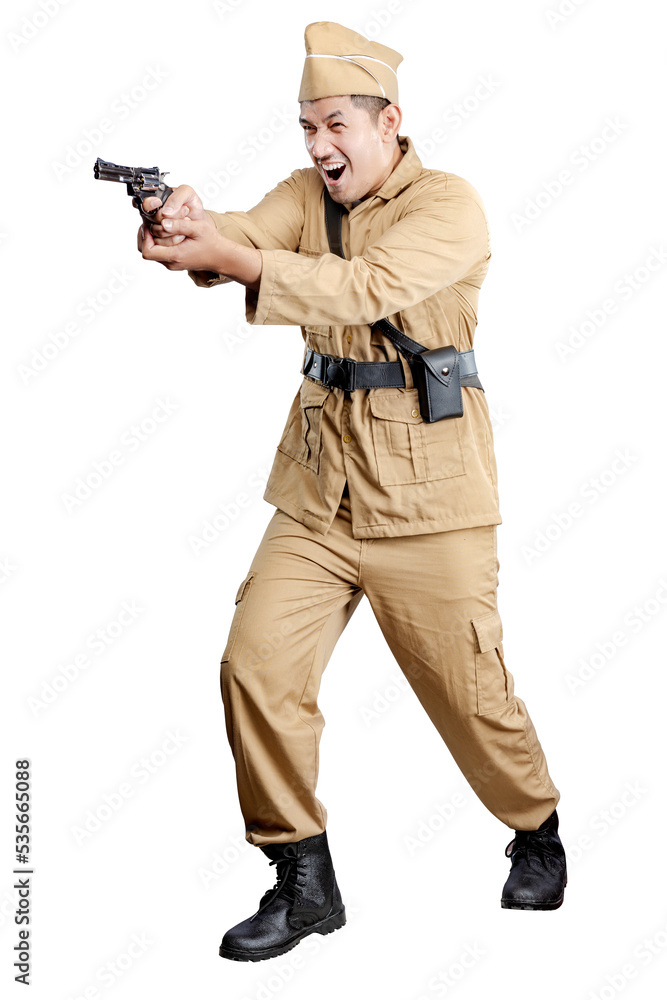 Indonesian freedom fighter standing while holding gun Indonesian freedom fighter standing while holding gun