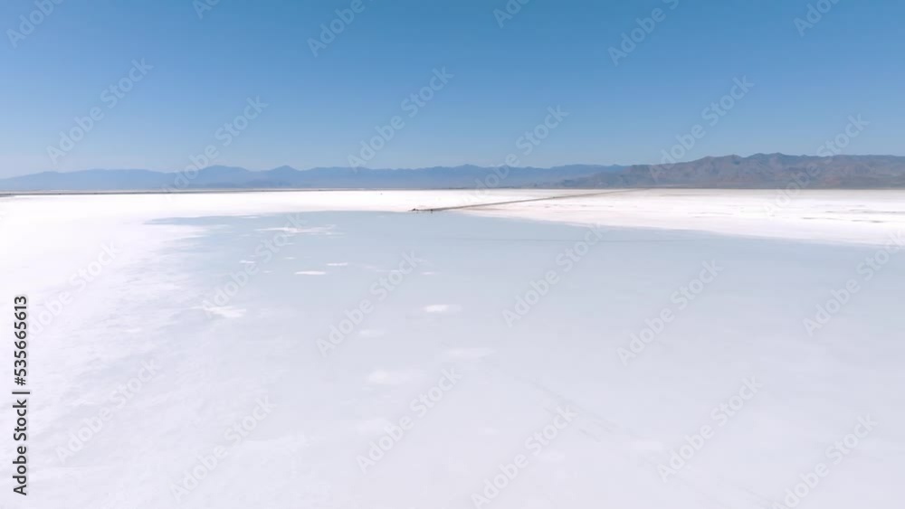 Aerial view of the Salt Lake City Utah Bonneville Salt Flats. Beautiful mirror reflection on blue sky over the Bonneville Salt Lakes. Holiday, vacation, freedom scene with horizon. Aerial view of the Salt Lake City Utah Bonneville Salt Flats. Beautiful mirror reflection on blue sky over the Bonneville Salt Lakes. Holiday, vacation, freedom scene with horizon.
