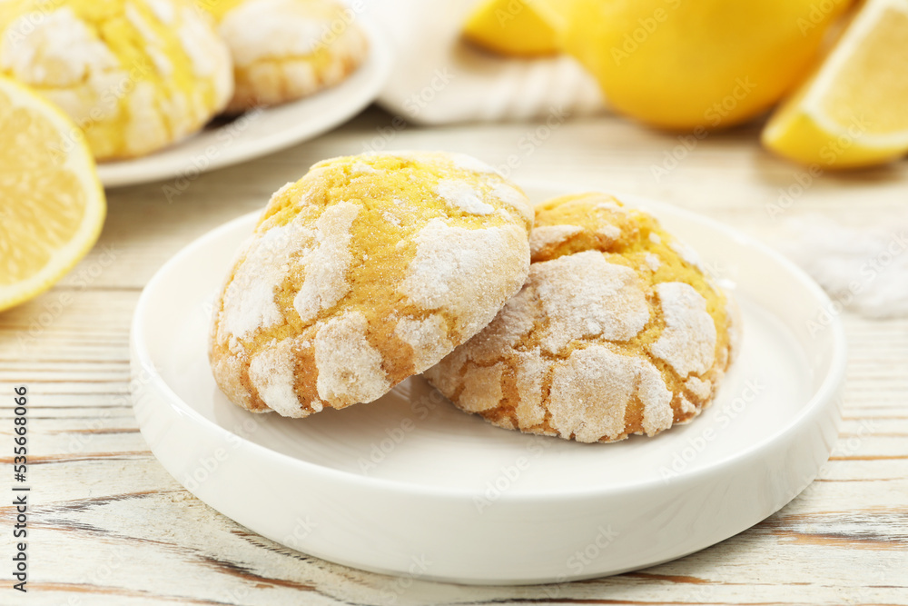 Tasty homemade lemon cookies on white wooden table Tasty homemade lemon cookies on white wooden table