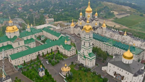 Aerial view of Pochaev Monastery, Orthodox Church, Pochayiv Lavra at day, Ukraine. Pochayiv Lavra in morning. View from the hills photo