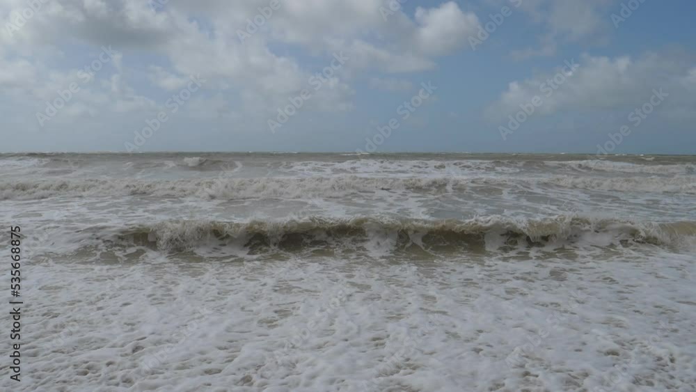 Slow Motion. Foamy waves crushing on the sea shore. Seven Sisters, England. Slow Motion. Foamy waves crushing on the sea shore. Seven Sisters, England.