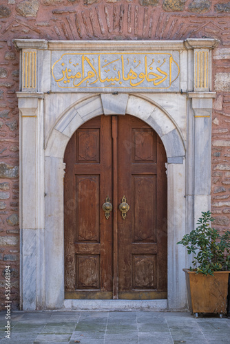 The old wooden door of the historical mosque. Arap Camii. istanbul, turkey. © mustafaoncul